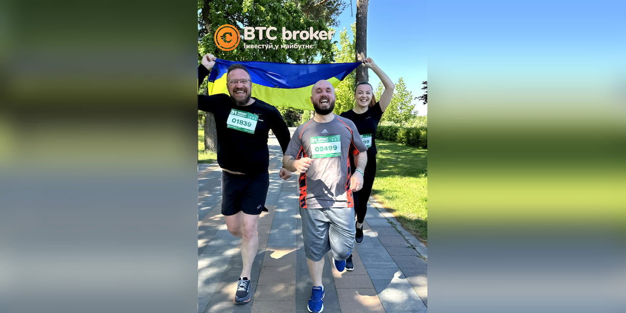 BTC Broker Employees Running with the Ukrainian Flag in Hand